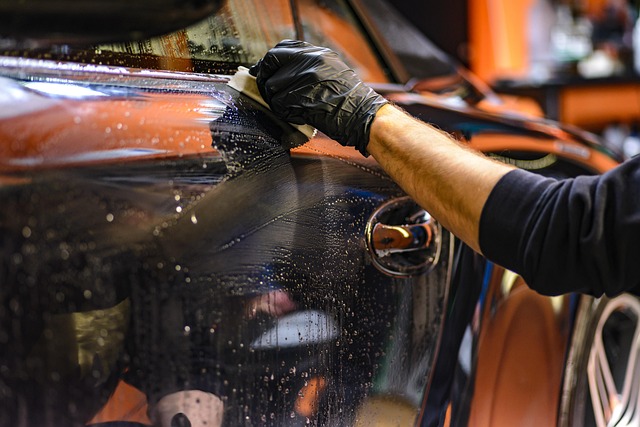 in carport man polishes car